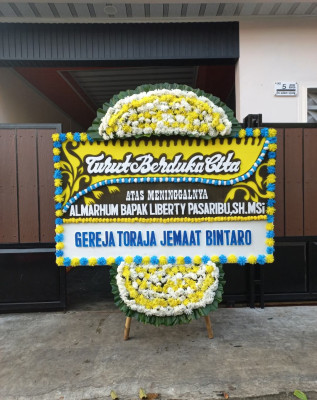 Papan Bunga Duka di Teluk Kimi